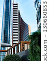 A Modern Urban Landscape Featuring Sleek Glass Towers and Contemporary Architecture with Greenery and Outdoor Spaces 130660853