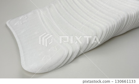 Womens sanitary pads on white background, top view. Feminine hygiene and menstruation product. Daily pad for period care, womens health, advertising, article or banner concept 130661133