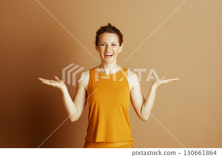 Cheerful Welcome: Open Hands in Orange Activewear Cheerful Welcome: Open Hands in Orange Activewear 130661864