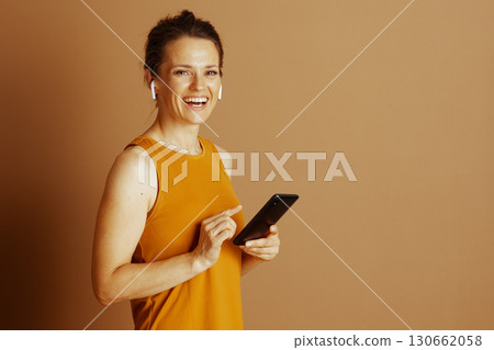 Cheerful Woman Interacting with Smartphone Cheerful Woman Interacting with Smartphone 130662058