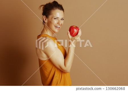 Radiant Woman with a Fresh Red Apple Radiant Woman with a Fresh Red Apple 130662068