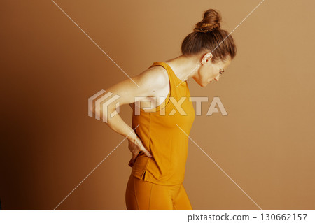 Woman Experiencing Lower Back Pain 130662157