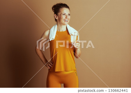 Refreshed Woman in Orange Activewear 130662441