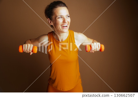 Strong Woman Performs Chest Fly Exercise 130662507