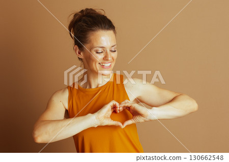 Woman Embracing Self-Love with Heart Hands 130662548