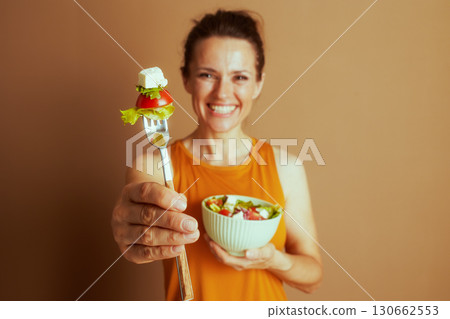 Woman with Mint Green Salad Bowl and Fork Woman with Mint Green Salad Bowl and Fork 130662553