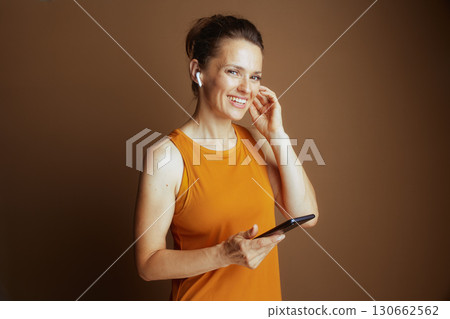 Woman Engaging with Tech, Looking at Camera 130662562