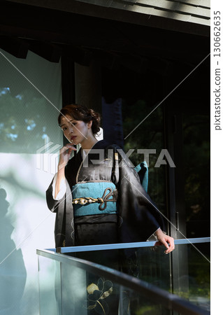 Portrait of a woman wearing traditional Japanese clothing at a shrine | Kimono, shrines, traditional beauty 130662635
