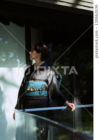 Portrait of a woman wearing traditional Japanese clothing at a shrine | Kimono, shrines, traditional beauty Portrait of a woman wearing traditional Japanese clothing at a shrine | Kimono, shrines, traditional beauty 130662636