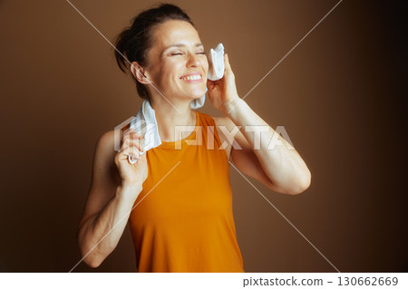 Woman Refreshing with Towel After Workout 130662669
