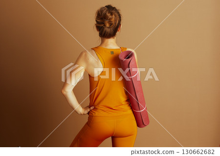 Confident Woman Ready for Yoga, Back View 130662682