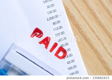 Financial Document Marked Paid Symbolizing Completed Payment 130662815