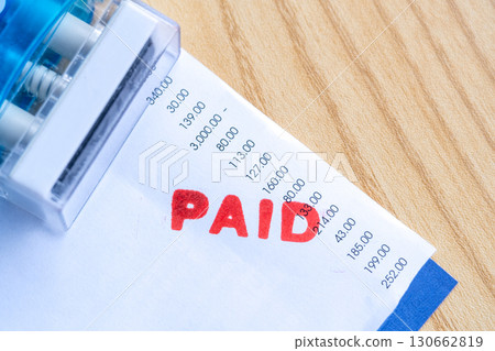 Red Paid Mark on Bill Invoice Paper with Numbers Red Paid Mark on Bill Invoice Paper with Numbers 130662819