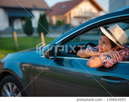 Traveler woman drives car through scenic countryside of Croatia Traveler woman drives car through scenic countryside of Croatia 130663005