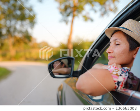 Traveler woman drives car through scenic countryside of Croatia Traveler woman drives car through scenic countryside of Croatia 130663008
