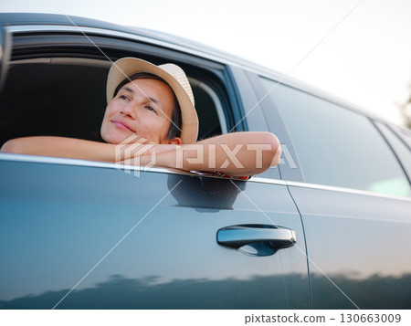 Traveler woman drives car through scenic countryside of Croatia 130663009