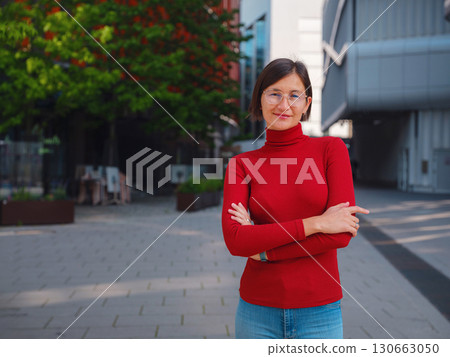 Woman in glasses stands in center of Frankfurt, Woman in glasses stands in center of Frankfurt, 130663050
