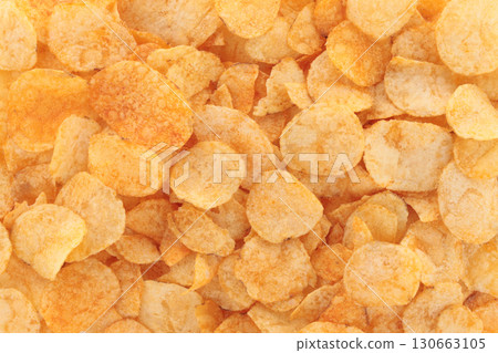 Background made of potato chips, full focus stacking for sharp texture, crisp detail and golden color 130663105