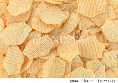 Background made of potato chips, full focus stacking for sharp texture, crisp detail and golden color 130663113