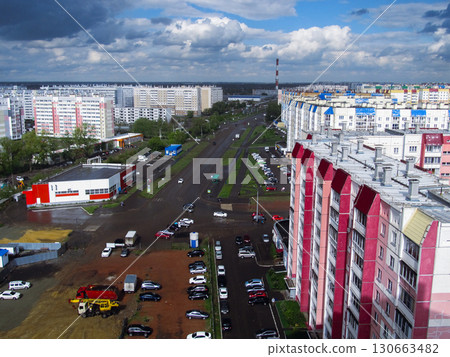 Panoramic cityscape with clouds and apartments 130663482