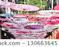 Colorful umbrellas hanging in the alley 130663645