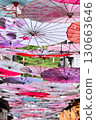 Colorful umbrellas hanging in the alley 130663646