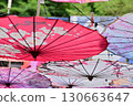 Colorful umbrellas hanging in the alley 130663647