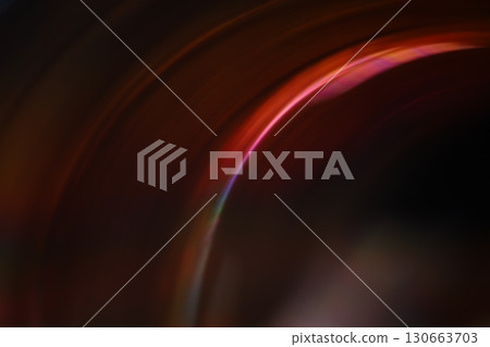 Curved lines of light on a dark background Curved lines of light on a dark background 130663703