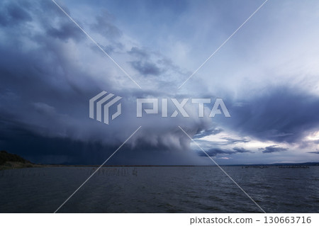 Storm clouds forming over the water of the Albufera de Valencia 130663716