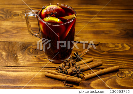 Mulled wine and spices on wooden table Mulled wine and spices on wooden table 130663735