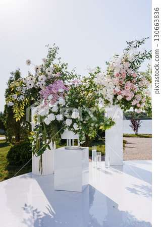 the area of a wedding ceremony on the banks with columns and flowers. 130663836
