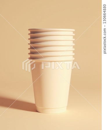 empty disposable cup on yellow background 130664880