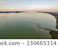 Spectacular sunset over lake Balaton and Balatonmariafurdo town, Hungary. 130665314