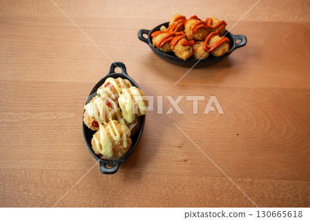 Delicious appetizers served on rustic plates at a vibrant dining setting Delicious appetizers served on rustic plates at a vibrant dining setting 130665618