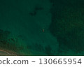 Aerial top nature view above green turquoise Thracian sea Greece Ellada. Beautiful woman bikini  130665954