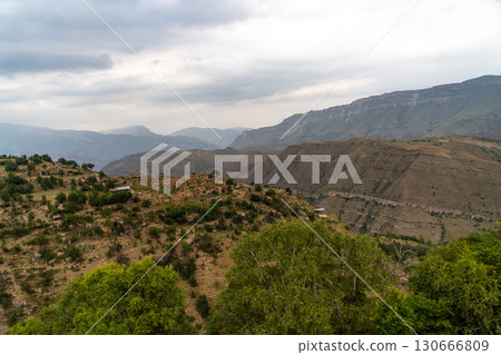 Caucasian mountain. Dagestan. Trees, rocks, mountains, view of the green mountains. Beautiful summer landscape. Caucasian mountain. Dagestan. Trees, rocks, mountains, view of the green mountains. Beautiful summer landscape. 130666809