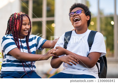 Two teens spending time together after schools Two teens spending time together after schools 130666841