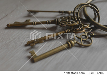 ornate keys displayed on rustic wood 130666902