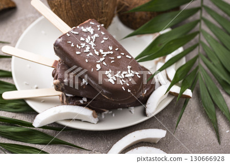 Coconut popsicles in chocolate glaze 130666928