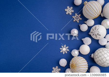 White Christmas Ornaments and Snowflakes on Blue Background 130666985