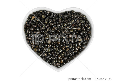 Black bean or Urad dal, black gram, vigna mungo in ceramic bowl isolated on the white background. Top view. Flat lay. Black bean or Urad dal, black gram, vigna mungo in ceramic bowl isolated on the white background. Top view. Flat lay. 130667050