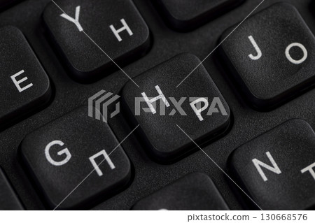 keyboard with Russian and English letters, computer keyboard layout with Latin and Cyrillic alphabet, close up 130668576