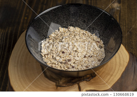 filled with instant oatmeal porridge with additives, closeup 130668619