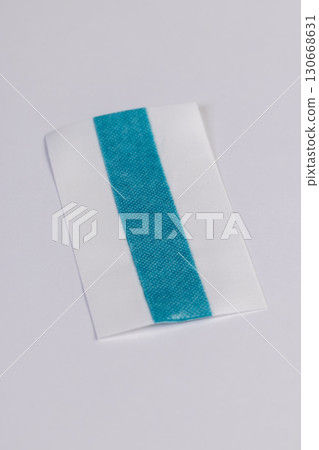 one band made of woven fabric with a strip of treated green liquid for wound disinfection, a long band that can be cut into pieces according to the size of the wound, a soft strip with disinfectant 130668631