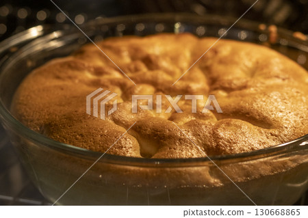 Close up shot of the baked pie in the oven. Food Close up shot of the baked pie in the oven. Food 130668865