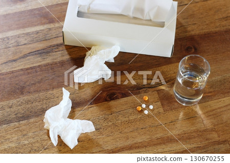 Images of tissue paper, rolled tissue, a glass of water, a syrup container, tablets, and medicine Images of tissue paper, rolled tissue, a glass of water, a syrup container, tablets, and medicine 130670255