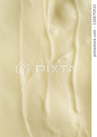 Close-up of smooth vanilla ice cream texture, creamy and rich dairy dessert background Close-up of smooth vanilla ice cream texture, creamy and rich dairy dessert background 130670410