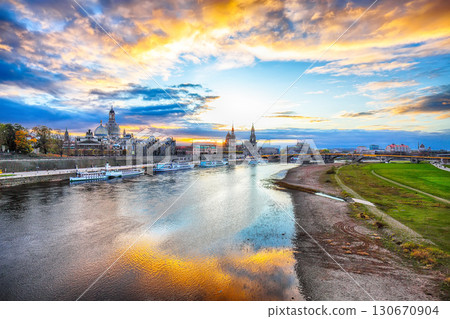 Amazing Sunset in Dresden on Elbe river with Cathedral of the Holy Trinity and Bruehl's Terrace. Amazing Sunset in Dresden on Elbe river with Cathedral of the Holy Trinity and Bruehl's Terrace. 130670904