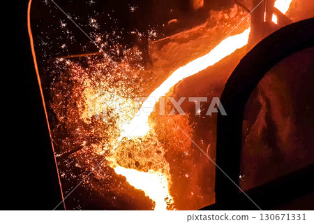 Molten iron stream in a steel mill. 130671331