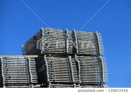 Image of stacked scaffolding materials (building frames) 130672416